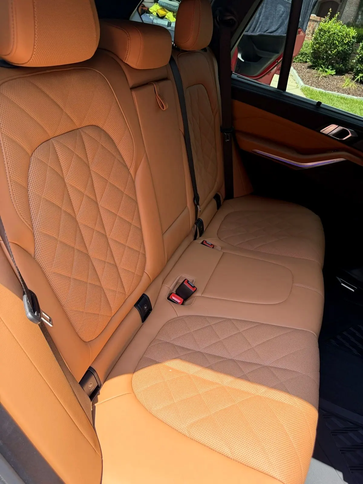 Cognac leather rear seats cleaned during a full detail